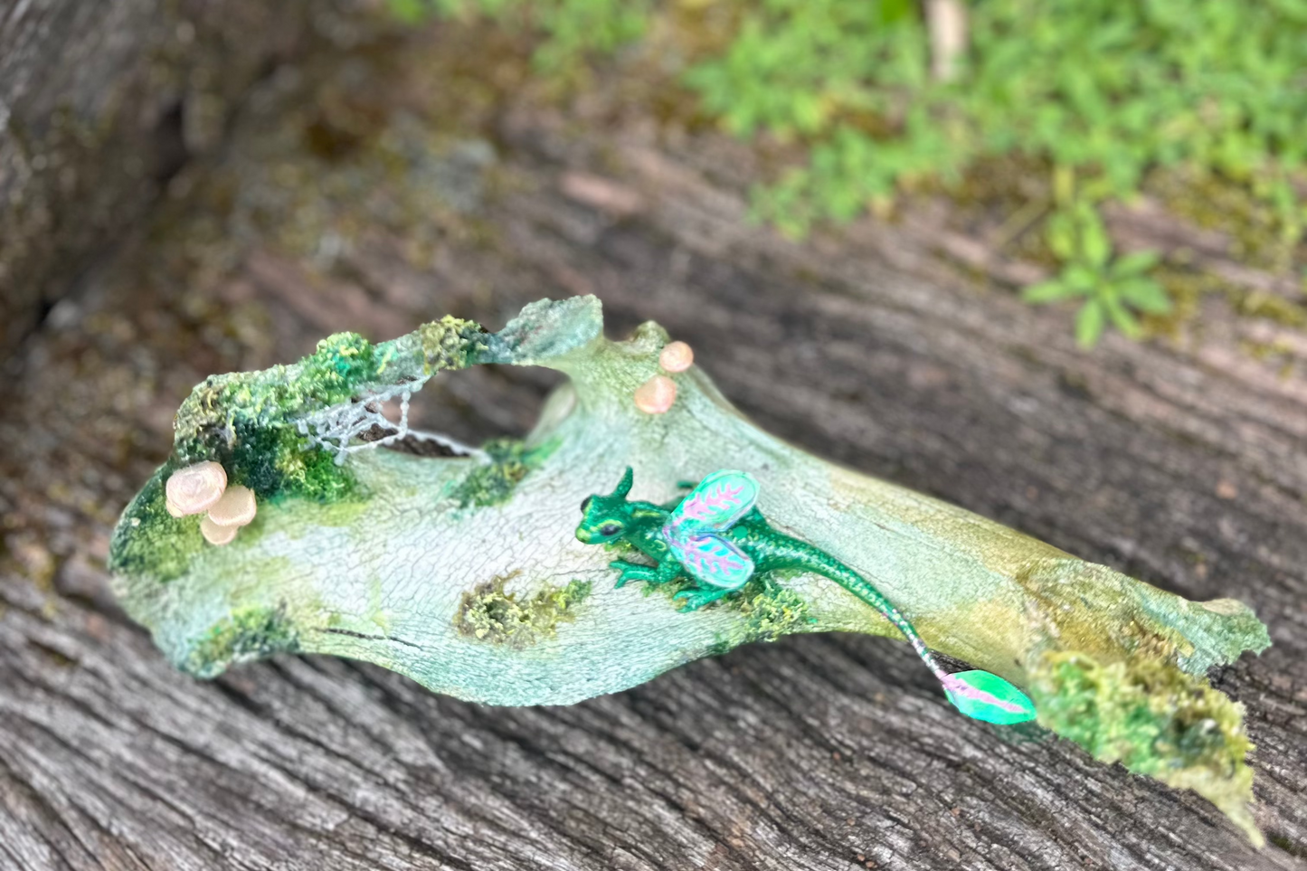 Polymer clay dragon on bone.